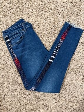 Levi’s size 30 high rise skinny raw hem jeans with patterned sides